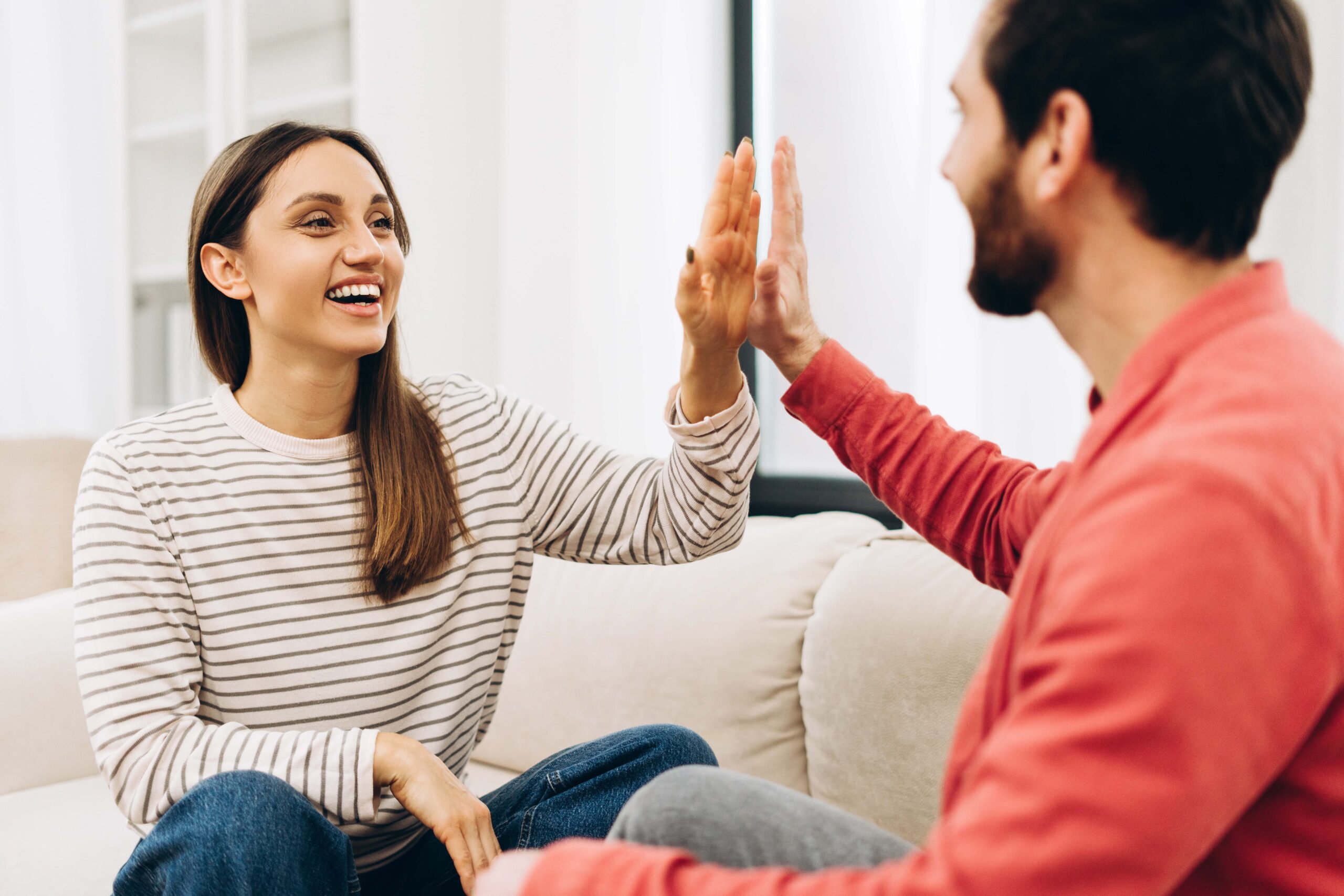 A woman reclining in a chair wearing a headband.