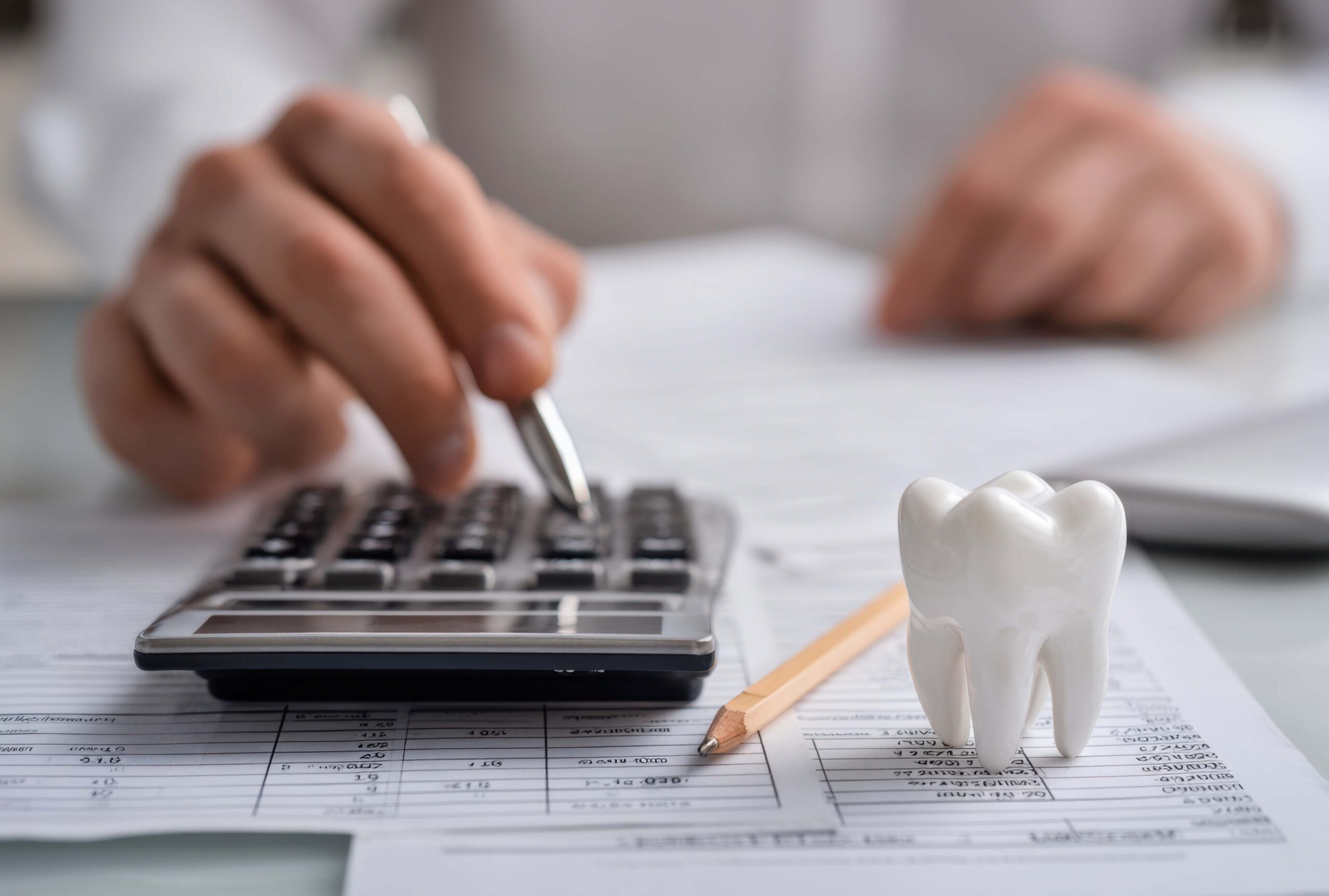 Rear view of a person looking pensively out a window.