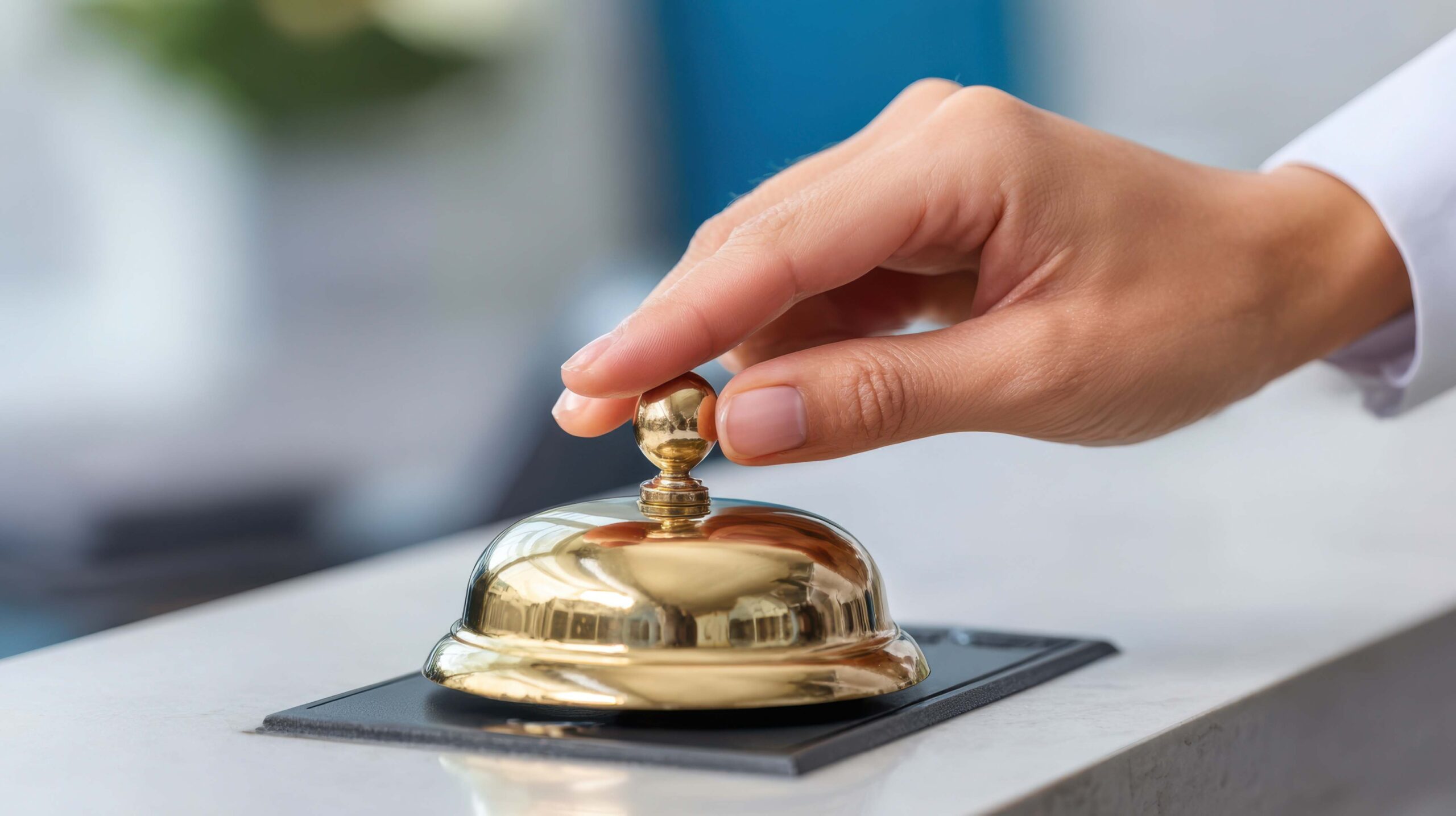 Rear view of a person looking pensively out a window.